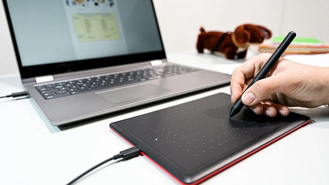 One by Wacom drawing pad with laptop for note taking